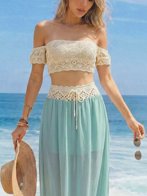 Crochet bandeau top and pastel blue maxi skirt with cutout detail and drawstring waist.