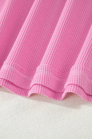 Pink waffle knit t-shirt with pocket detail and stitched seams
