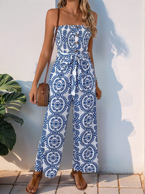 Bustier print wide leg jumpsuit in blue and white with decorative buttons and tie waist.