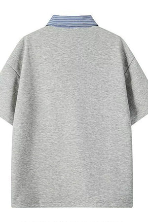 Light gray relaxed fit polo with a blue striped collar.