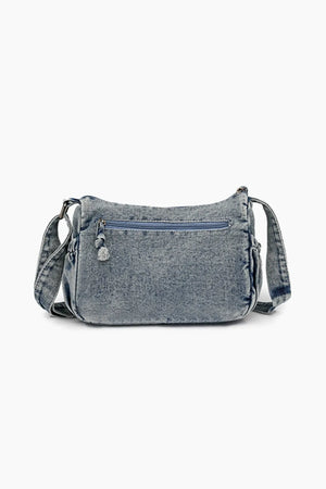 Acid wash denim crossbody bag with zipper detail and adjustable strap