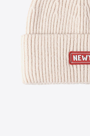 Beige ribbed acrylic beanie with New York patch detail