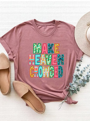 Dusty pink t-shirt with textured "Make Heaven Crowded" lettering in colorful patterns.