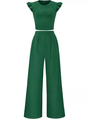 Green ruffled cap sleeve maternity top with ruched waist and wide leg pants.