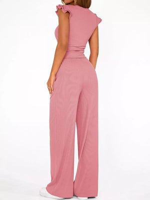 Pink ruffled cap sleeve maternity two-piece set with wide leg pants.
