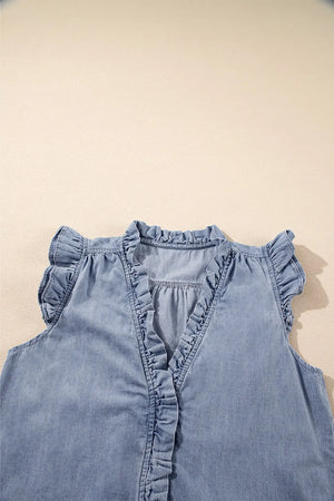 Chambray sleeveless blouse with ruffle trim neckline, placket, and cap sleeves in medium wash cotton.