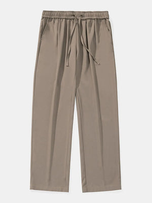 Relaxed palazzo trousers in taupe with elastic drawstring waist and side pockets.