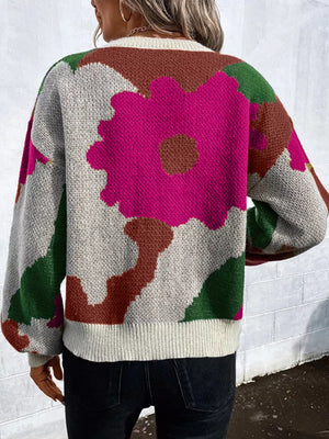 Abstract floral knit sweater with round neck in burgundy, hot pink, green, blue, black, and olive.