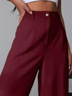 Burgundy high-waisted pleated wide-leg maternity trousers with button detail.