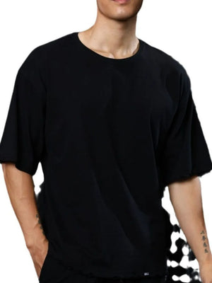 Black oversized tee with raw edges and a crew neck.