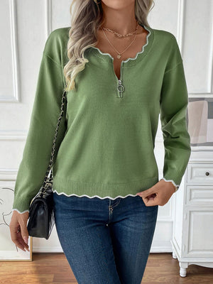 Lime knit sweater with zip neck and scalloped trim details.