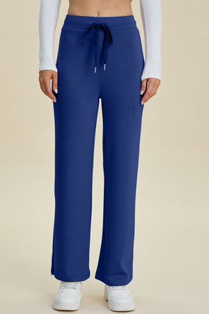 Blue wide leg lounge pants with drawstring waist and flared hem