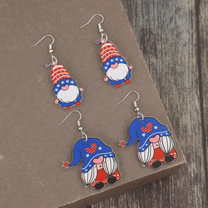 Patriotic gnome acrylic dangle earrings in royal blue with stars and stripes design.