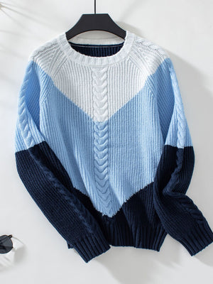 Chevron cable knit sweater in pastel blue and white with navy accents.