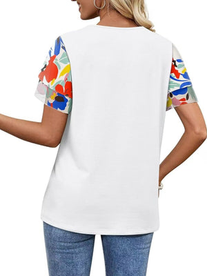 White t-shirt with layered ruffled short sleeves in a multicolor floral print.