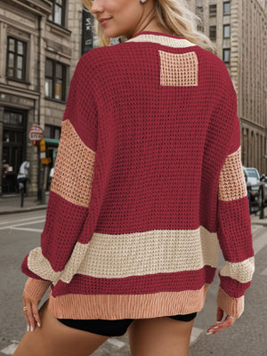 Burgundy waffle knit cardigan with colorblock sleeves and horizontal stripe detail.