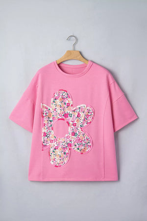 Pink cotton oversized tunic t-shirt with a large floral patch detail.