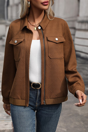 Textured chevron zip-front utility jacket in burnt umber with two chest pockets and a collared neckline.