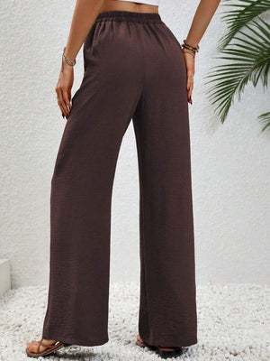 Textured palazzo trousers in dark brown with a drawstring waist and wide legs.