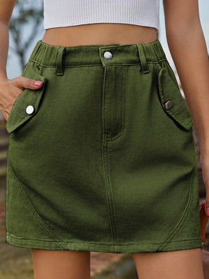 Army green utility pocket mini skirt with elastic waist and button closure.