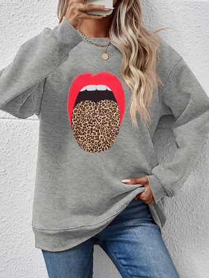 Gray sweatshirt with a bold red mouth and leopard tongue graphic.