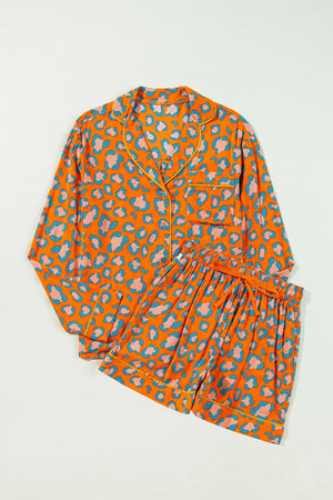 Orange leopard print satin pajama set with collared top and drawstring shorts.