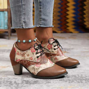 Floral patchwork lace-up ankle boots in brown with a block heel and lace-up closure.