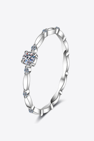 Delicate silver band ring with scalloped edges and small diamonds