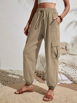 Khaki textured cargo lounge trousers with drawstring waist and cuffed ankles.