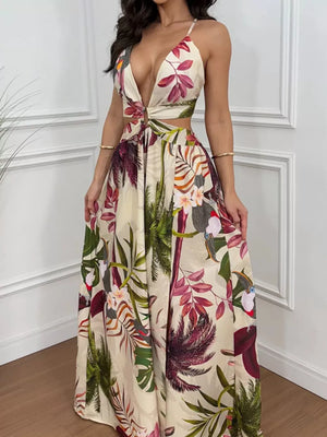 Vibrant cutout maxi dress with tropical print, deep V-neck, and decorative ring detail.