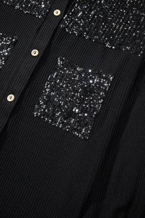 Black textured knit shirt jacket with sequin pockets and button front.
