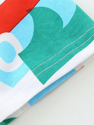 Toddler cotton t-shirt with abstract marine print in red, green, blue, and white.