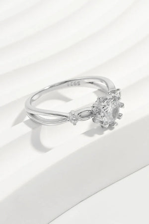 Silver halo ring with round-cut zirconia and floral accents