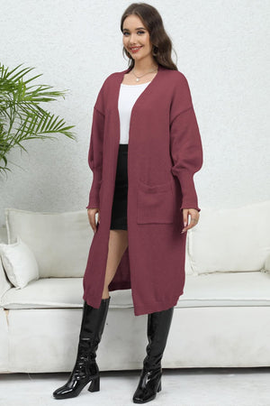 Burgundy oversized pocketed knit cardigan with V-neck and long sleeves