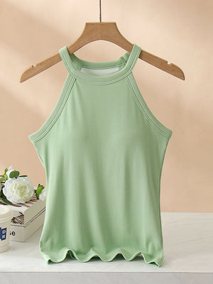 Ribbed halter tank top in Gum Leaf green with built-in bra and lettuce hem detail.