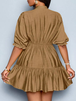 Brown tiered dress with ruffled sleeves and cinched waist.