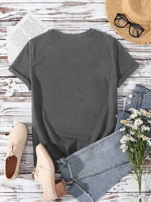 Dark gray basic t-shirt with rolled sleeves and a crew neck, styled with jeans and shoes.