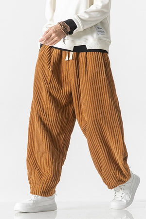 Relaxed fit corduroy wide-leg cargo pants in orange with a drawstring waist.
