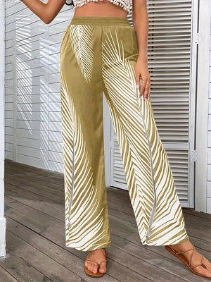 Palm print palazzo trousers in khaki with white palm leaf pattern and side slits.