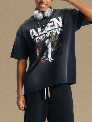 Black oversized graphic tee with alien print and short sleeves.