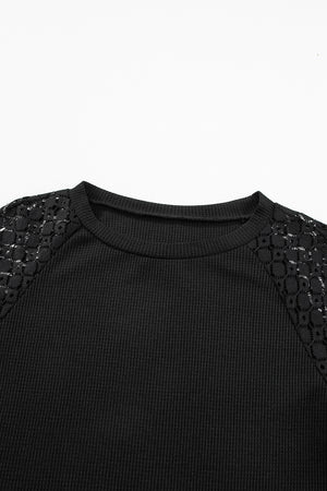 Black waffle knit raglan top with lace yoke detail
