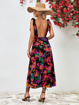 Maxi dress with abstract print, tie straps, and tiered skirt.