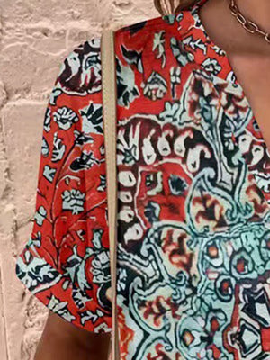 Americana Henley print top in red with a V-neck and short sleeves.