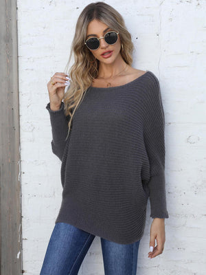 Off-the-shoulder dark gray ribbed dolman knit sweater with long sleeves.