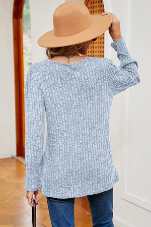 Light blue ribbed button-down top with long sleeves and asymmetric hem