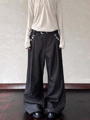 Men's black wide leg sweatpants with decorative buttons and a belt.