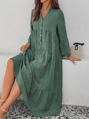 Green tiered ruffle hem v-neck dress with button front and bell sleeves.