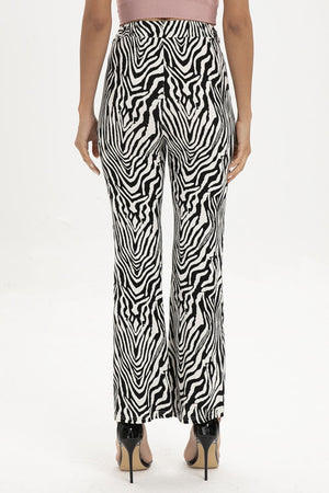 Zebra print flared leg trousers with a high waist and wide leg.