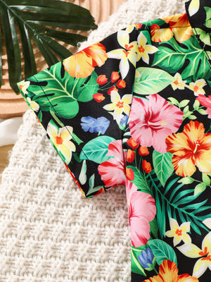 Baby boys' black tropical print short sleeve shirt with hibiscus flowers and leaves.