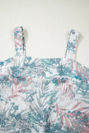 Botanical print maternity one-piece swimsuit with square neckline and adjustable straps.